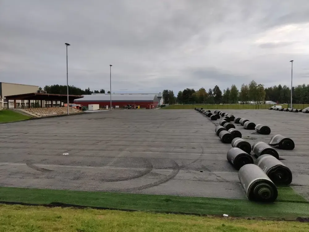 Rolling up and relocating artificial grass